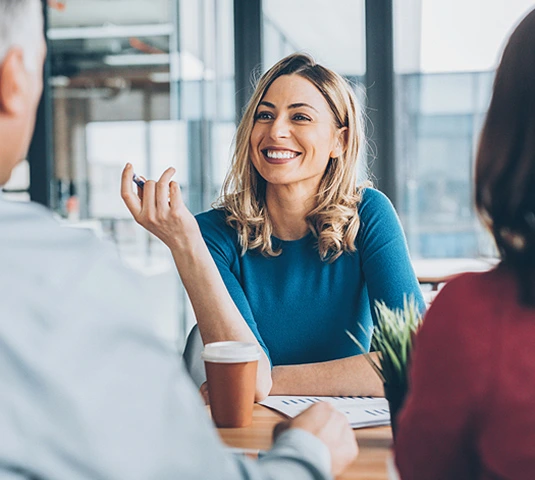 Smiling Advisor Meeting With Clients